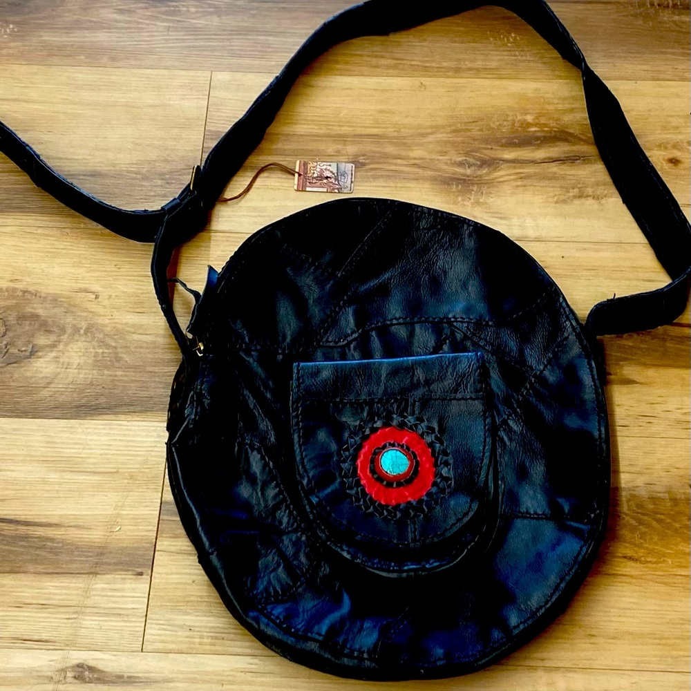 Leather purse , brand new , beautiful detail on front pocket